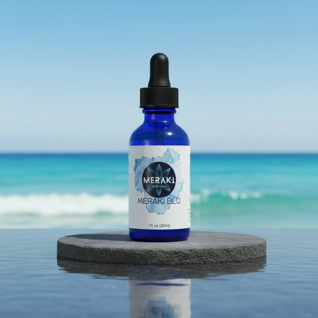 Meraki Blu USP Grade Methylene Blue 150mg on stone pedestal with ocean background